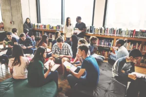 students study and talk in a college library