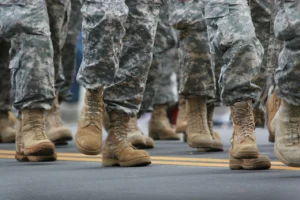 legs and feet marching in fatigues and military boots