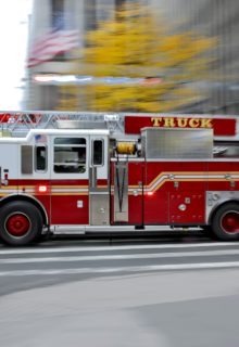 fire truck driving through a city