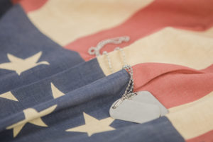 American flag with dog tags