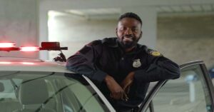 police officer smiling in his car