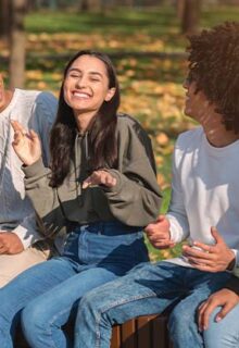 teens smiling and talking in a group