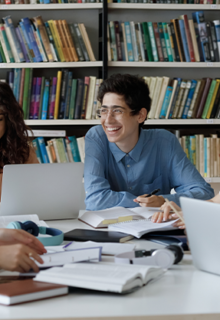 PHD students chatting in a library