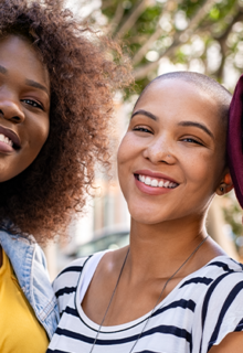 Women of different backgrounds smiling