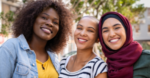 Women of different backgrounds smiling