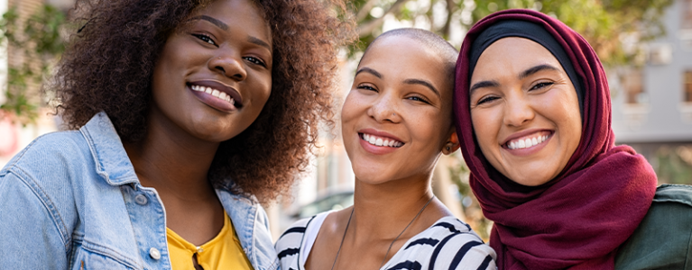 Women of different backgrounds smiling