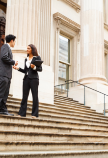 policy makers on the steps of a courthouse