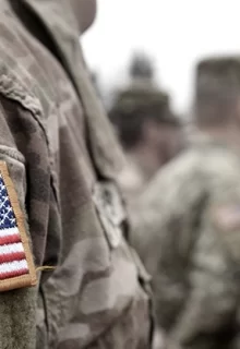 closeup of American flag patch on army fatigues