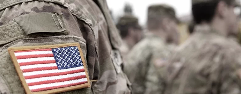 closeup of American flag patch on army fatigues