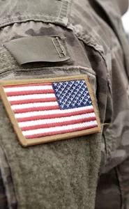 closeup of American flag patch on army fatigues