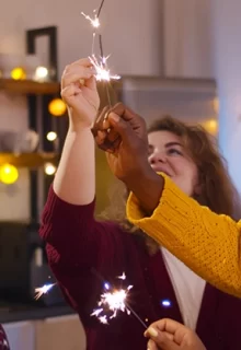 family and friends light sparklers together