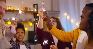 family and friends light sparklers together