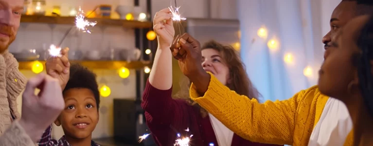 family and friends light sparklers together