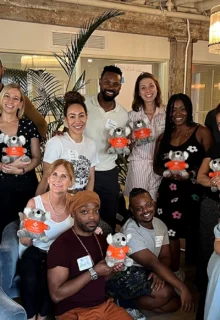 MHFA trainees gather holding stuffed ALGEE koala bears