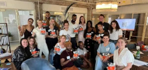 MHFA trainees gather holding stuffed ALGEE koala bears