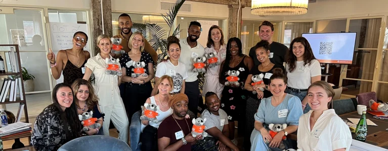 MHFA trainees gather holding stuffed ALGEE koala bears