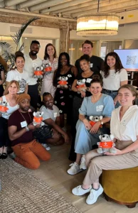MHFA trainees gather holding stuffed ALGEE koala bears