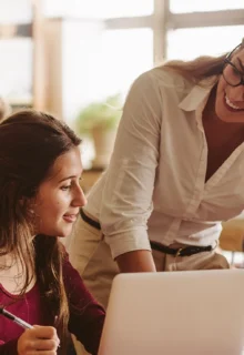 teacher works with students in a classroom