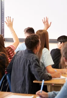 teacher calls on students with their hands raised