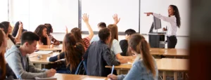 teacher calls on students with their hands raised