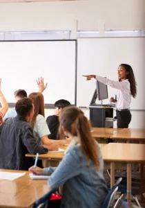 teacher calls on students with their hands raised