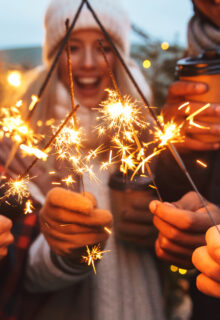 People holding sparklers