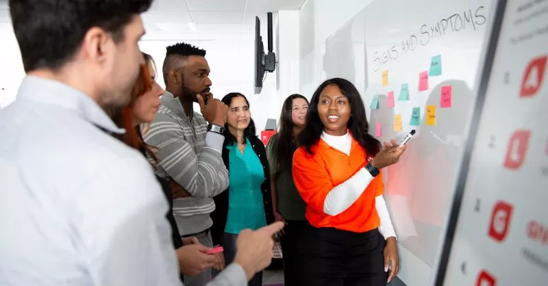 A mental health first aid instructor teaches students