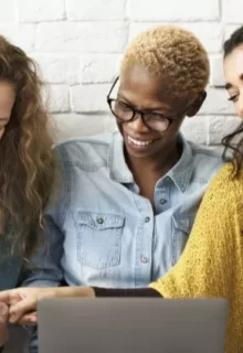 happy employees talking and laughing together